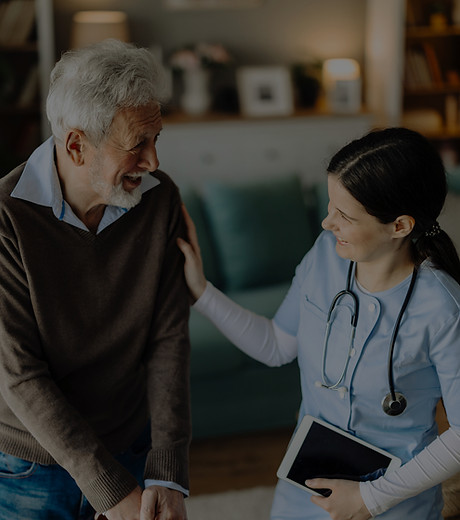 Nurse providing wound care to senior patient